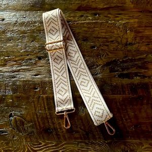 Guitar strap. Or purse strap.